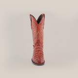 A single Crocodile Tail Print Cogñac boot is displayed against a white background, featuring intricate stitching, a round toe, decorative patterns along the shaft, and a premium leather sole for comfort and durability.