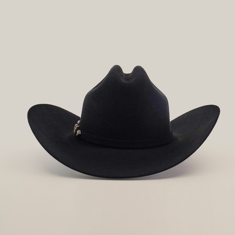 The 5X Dorado Black is a Western cowboy hat crafted from wild rabbit and beaver fur felt, featuring a wide brim and decorative band. Displayed against a plain white backdrop, it’s manufactured by Milano Hat Co. and exudes classic charm.